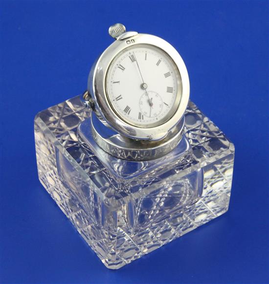 A George V silver mounted cut glass combination inkwell, pocket watch holder and miniature photograph frame, height 2.75in.